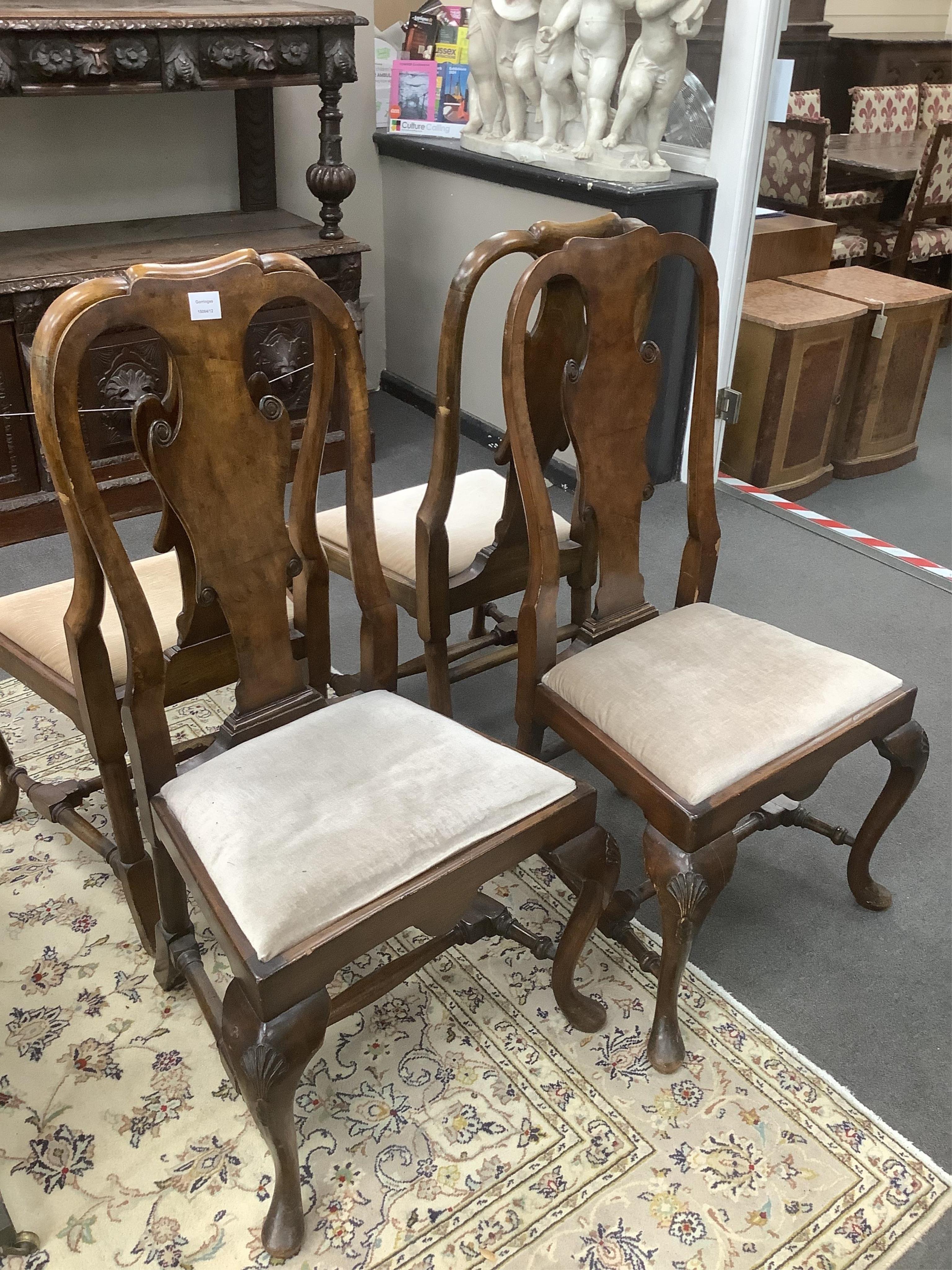 A set of four Queen Anne revival walnut dining chairs, width 52cm, depth 40cm, height 107cm. Condition - fair